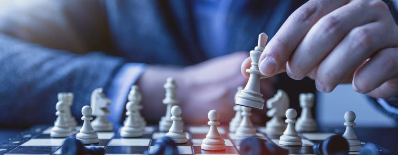 Man playing chess to represent a business continuity and disaster recovery plan