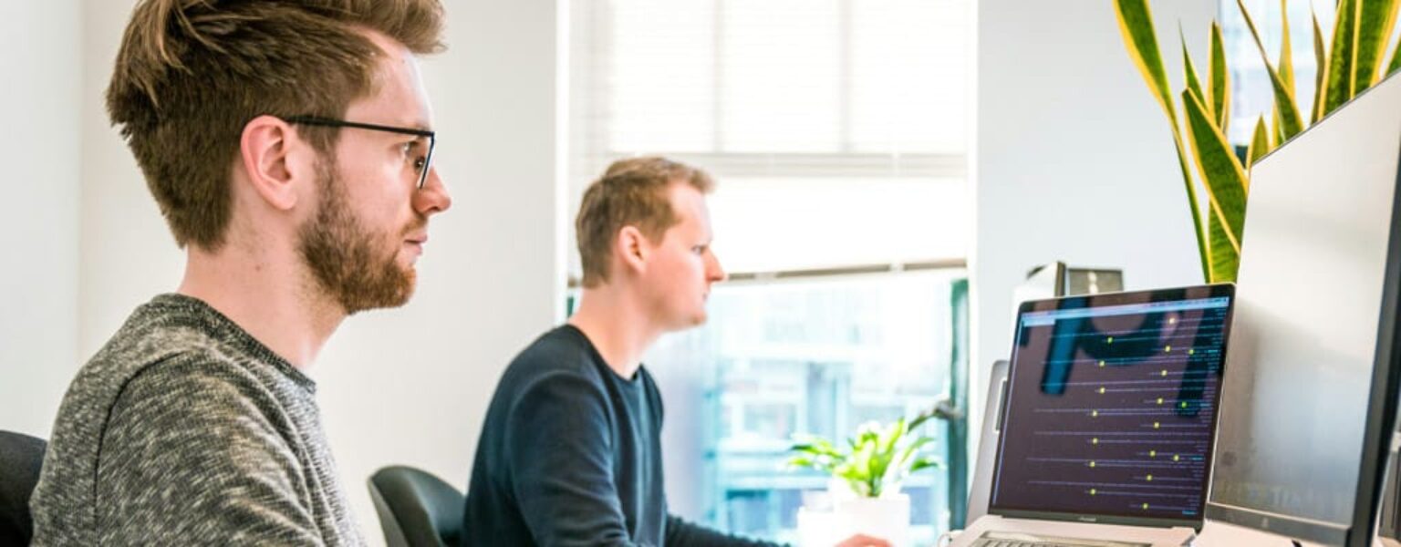 Men working on enterprise content management software